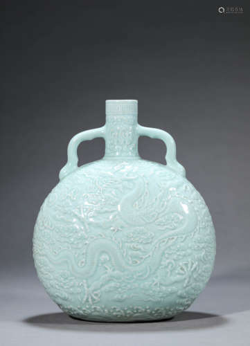 A Carved Celadon-Glazed Dragon Vase