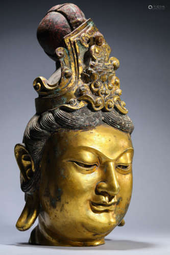 A Gilt-Bronze Head Of Buddha