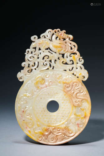 A White And Russet Jade Openwork Chilong Bi-Shaped Pendant