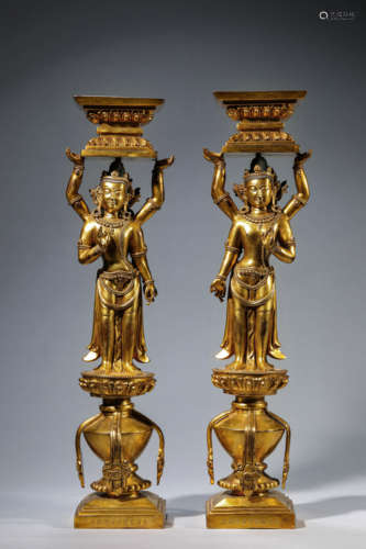 A Pair Of Gilt-Bronze Eight-Armed Avalokitesvara Candlestick...