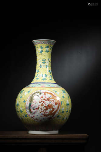 A YELLOW-GROUND FAMILLE ROSE DRAGON PHOENIX VASE, XUANTONG M...