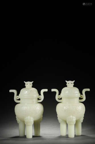 A PAIR OF KHOTAN WHITE JADE INTERLOCKING FLORAL DOUBLE-EARS ...