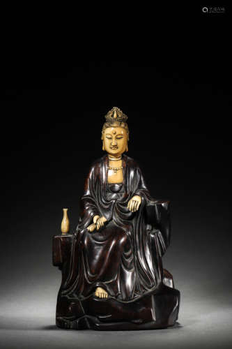 A RED SANDALWOOD BONE-INLAY SEATED GUANYIN FIGURE