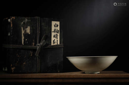 A WHITE GLAZED INCISED 'BEAST' CONICAL BOWL