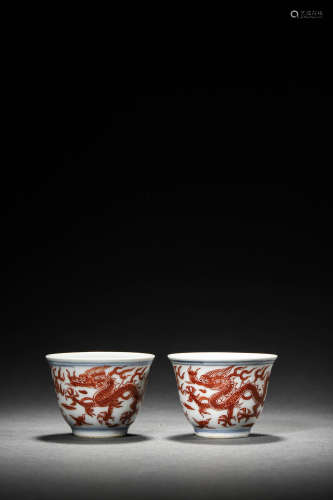 A PAIR OF BLUE AND WHITE UNDERGLAZE RED DRAGON CUPS, JIAJING...