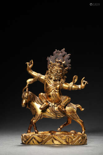 A GILT BRONZE BUDDIST HEAVENLY GUARDIAN