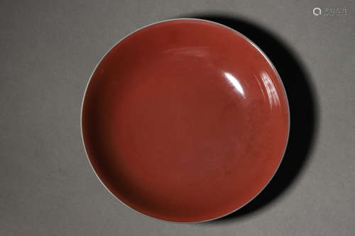 A MONOCHROME SACRIFICIAL-RED GLAZE PLATE, DAOGUANG MARK