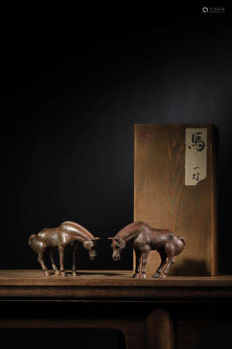 A PAIR OF BRONZE HORSES