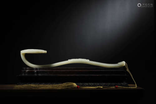 A WHITE JADE RUYI-SCEPTRE AND RED SANDALWOOD STAND