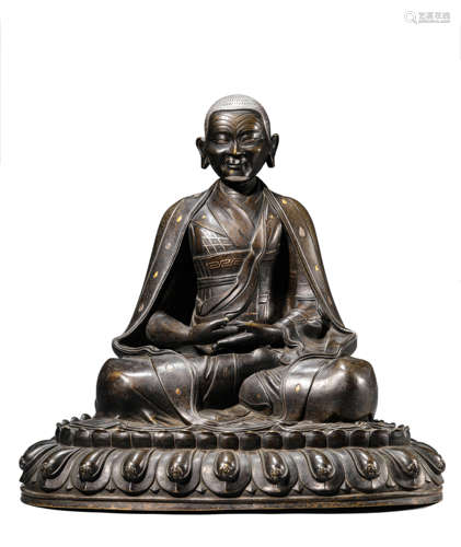 A Tibetan Bronze and Gold Inlaid Karmapa Statue