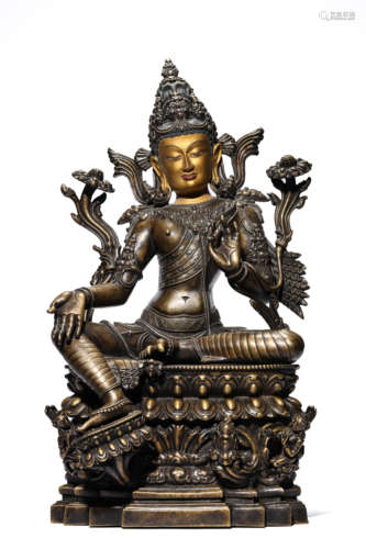 A Tibetan Copper and Silver Inlaid Green Tara Statue