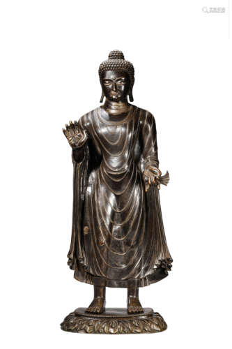 A Tibetan and Silver Inlaid Sakyamuni Statue