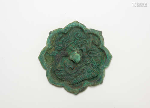 Tang Dynasty- A Bronze Foliate-Rim ‘Dragon’ Mirror
