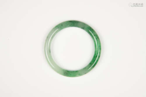 A Semi-Translucent Green Jadeite Bangle
