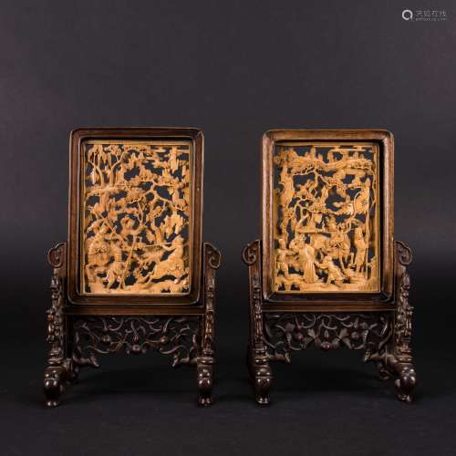 A PAIR OF CARVED HUANGYANG WOOD 'FIGURAL' TABLE SCREENS, QIN...