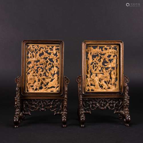 A PAIR OF CARVED HUANGYANG WOOD 'FIGURAL' TABLE SCREENS, QIN...