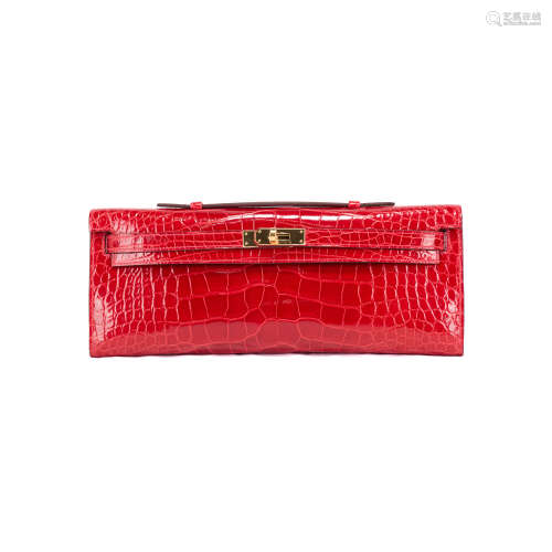 HERMES KELLY CUT CLUTCH IN BRAISE RED MISSISSIPPIENSSIS ALIG...