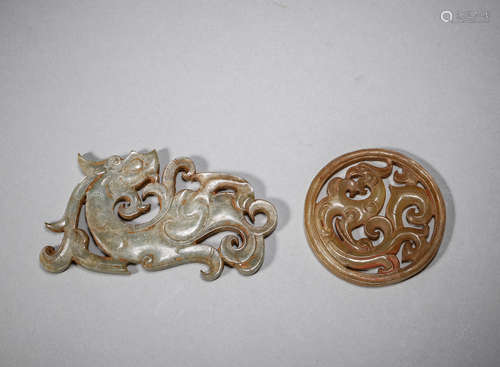 A pair of dragon and phoenix shaped jade pendants,Han Dynast...