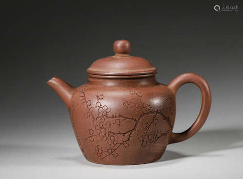 A plum blossom patterned zisha clay teapot ,Qing Dynasty,Chi...