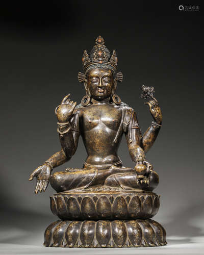 A copper four-armed Guanyin bodhisattva statue