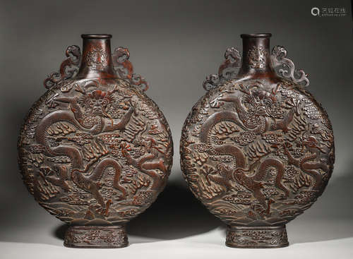 A pair of cloud and dragon patterned aloeswood moon flasks,Q...