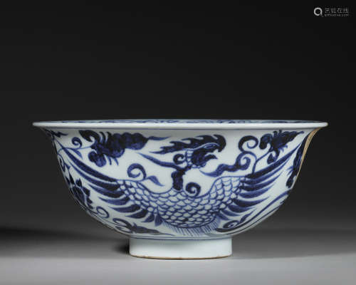 A dragon and phoenix patterned blue and white porcelain bowl...