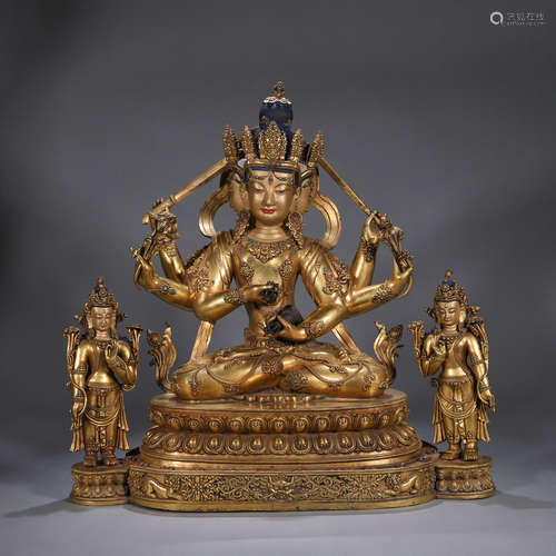 A copper three-headed six-armed buddha statue