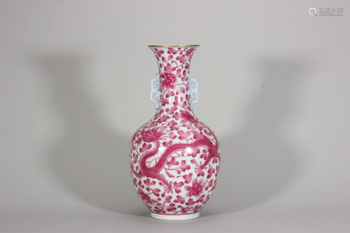 A dragon and phoenix patterned double-eared red glaze porcel...