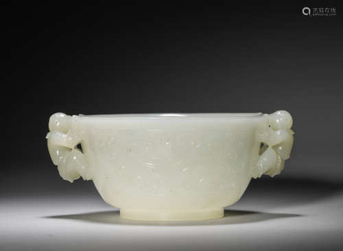 A taotie patterned jade cup with figure shaped ears,Qing Dyn...