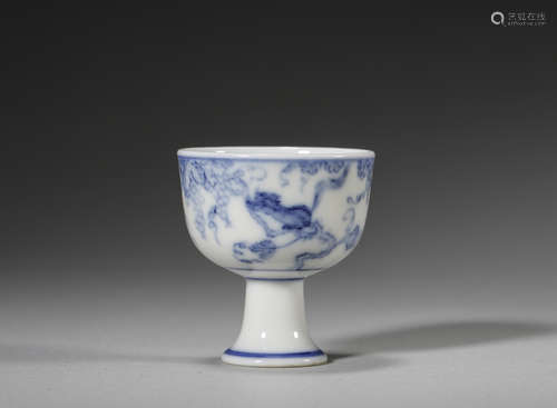 A grape and squirrel patterned blue and white porcelain cup,...