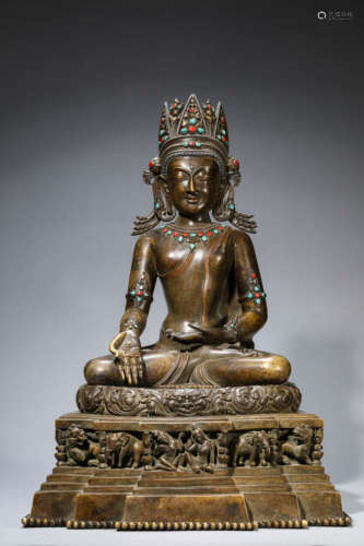 A Tibetan Copper and Gems Inlaid Sakyamunia Statue