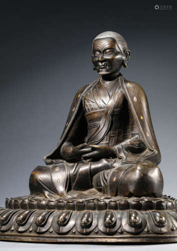 A Tibetan Copper and Silver-Inlaid Karmapa Statue