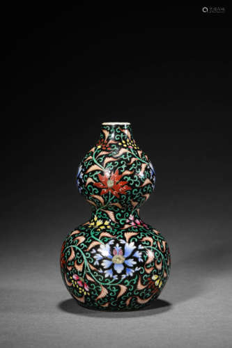 A Black Ground Wucai Interlocking Flower Double-Gourds Vase,...