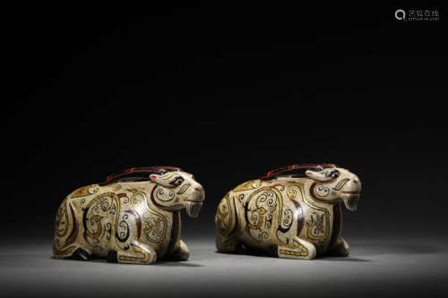 A Pair Of Stone Gold-Decorated Rams Ornaments