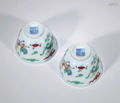 A pair of colorful dragon patterned cups Chinese Qing Dynast...