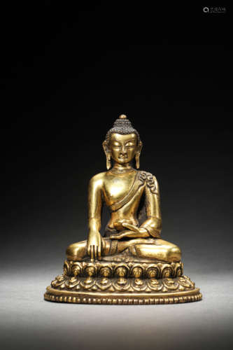 A GILT BRONZE FIGURE OF SHAKYAMUNI