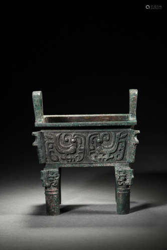 A BRONZE MYTHICAL BEAST MASKS SQUARE DING VESSEL