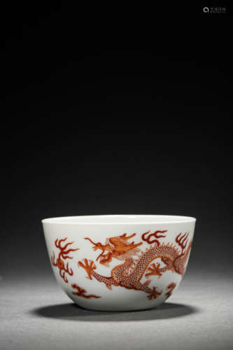 AN IRON-RED DOUBLE DRAGONS CHASING A FLAMING PEARL CUP, QIAN...