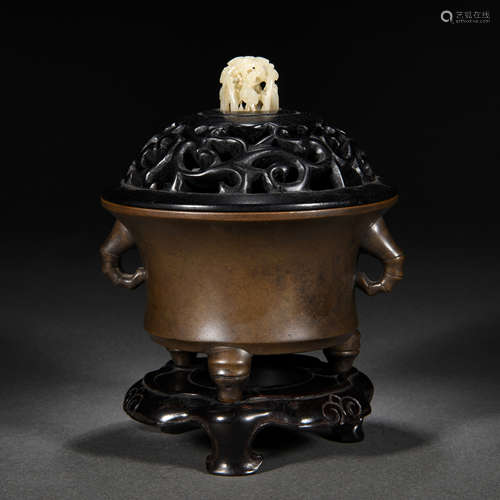 A chinese bronze tripod censer with cover