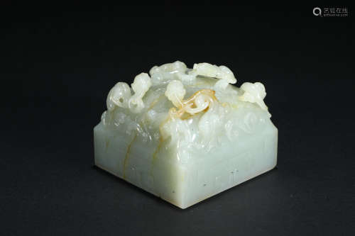 A Chinese Carved White Jade Chilong Seal