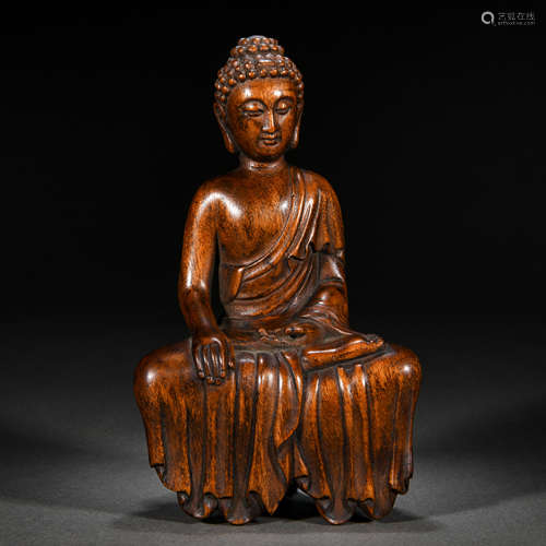 A chinese carved aloes wood seated buddha