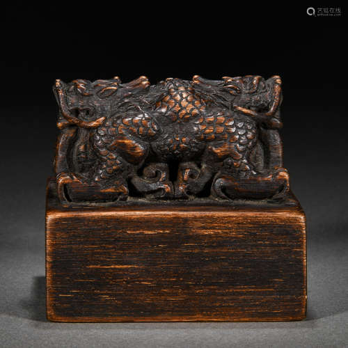 A chinese carved aloes wood dragons seal