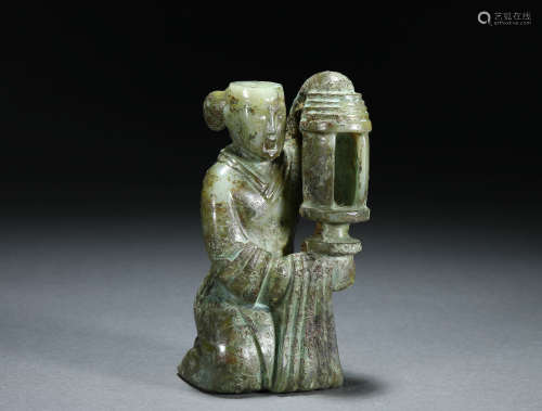 A Chinese Carved Jade Figural Lamp Holder