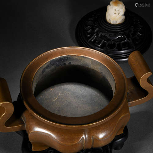 A chinese bronze tripod censer with cover