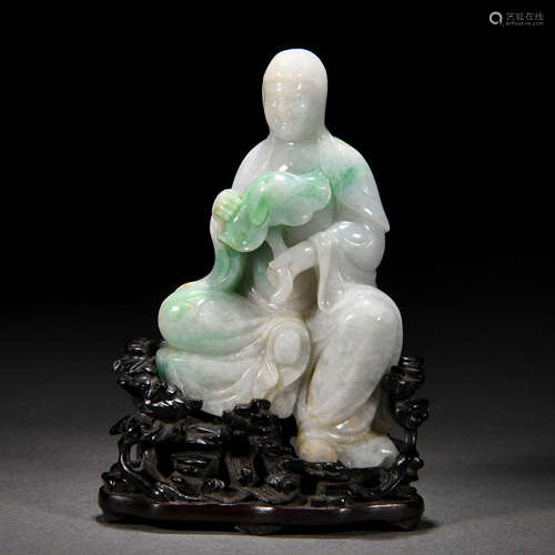 A Carved Jadeite Seated Figure