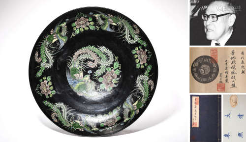 A LARGE BLACK-GROUND FAMILLE ROSE PHOENIX PLATE