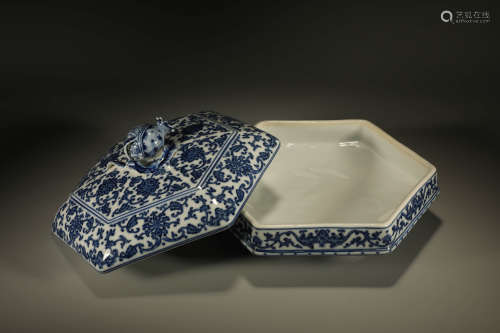 A BLUE AND WHITE FLORAL COVERED BOX