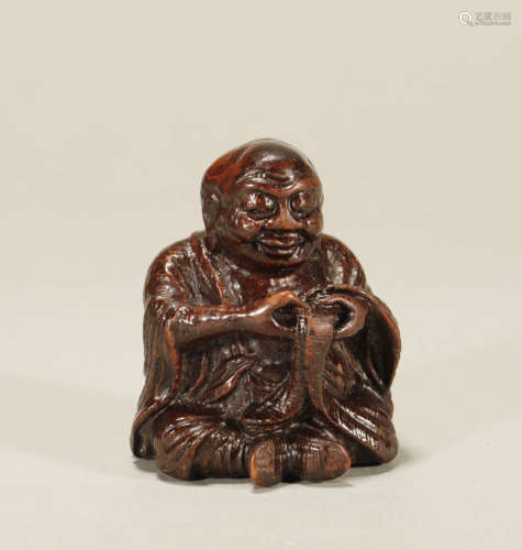 A CARVED BAMBOO FIGURE