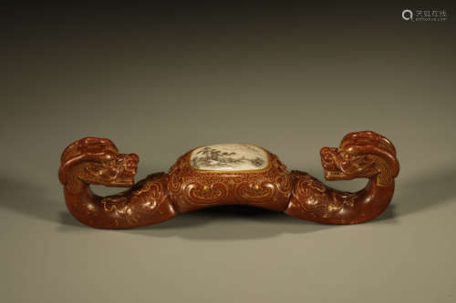 A PERSIMMON-GLAZED DRAGON BRUSH REST