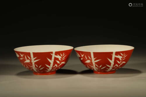 A PAIR OF RED-GLAZED REVERSE-DECORATED BAMBOO BOWLS